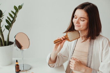 Woman combing her hair