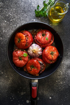baked stuffed tomatoes on a pan