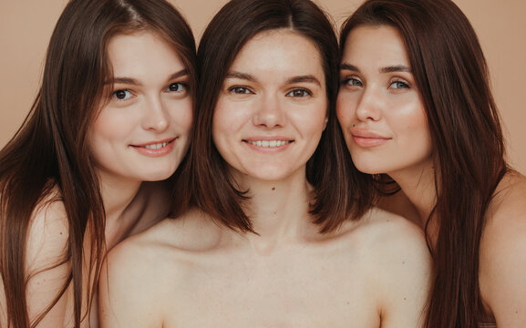 Three cheerful brunette women
