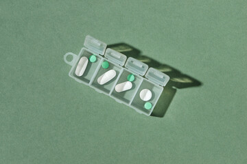 Daily drug dose - pills organized in a pill box
