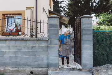 Granny waiting for family in yard