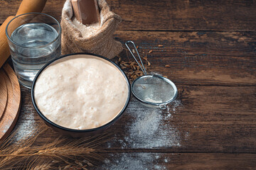 The sourdough for bread is active. Ingredients for making bread.