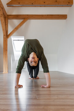 Flexible guy doing Wheel exercise