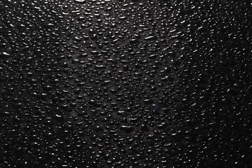 Water droplets on black background