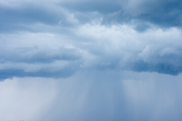 Naklejka na ściany i meble Cumulus clouds, dark blue summer sky of bad weather, thunderstorm beginning of heavy rain