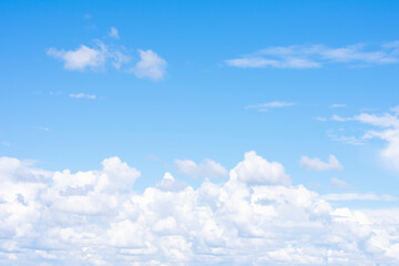 A lot of white cumulus clouds far on horizon as natural background with copy space.