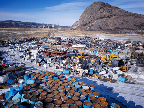 Greenland waste dump for fossil fuels, oil barrels, trash and rubbish disposal