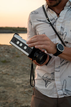 Anonymous man holding 8mm film camera