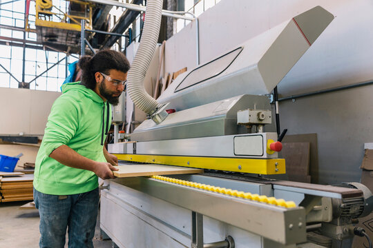 Hispanic Man making Cabinet Parts