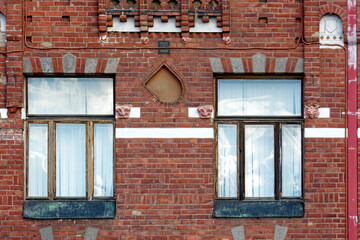Windows on a brick wall.