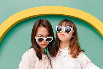 funny portrait of two fashionable women