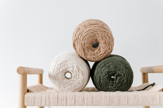 Natural yarn needles on chair