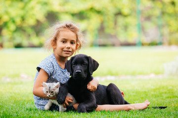 Pets giving their love to small children