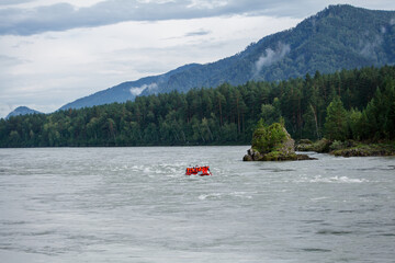 Rafting on a fast flowing mountain river. Travel photo of Russia in the summer. 