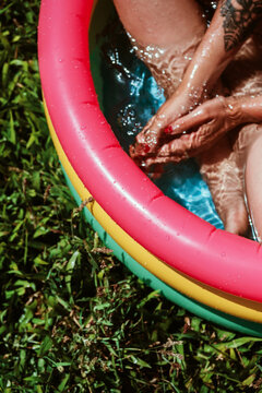 woman in a small plastic pool