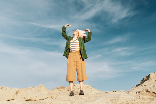 Creative Fashion portrait of Stylish teenager posing in desert