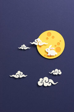 Mid autumn festival, with full moon and rabbit in paper cut style