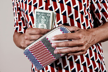 man taking off some dollar from his wallet