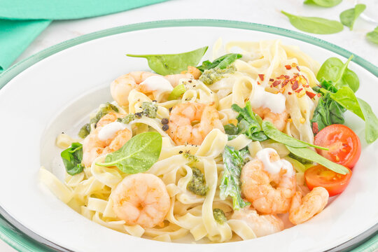 Pasta tagliatelle with prawns and spinach cream sauce series image 01