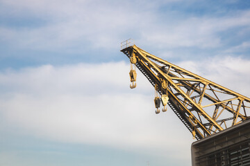 yellow crane on blue sky