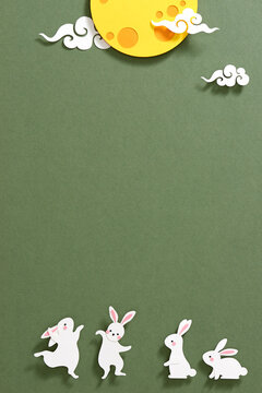 Mid autumn festival, with full moon and rabbit in paper cut style