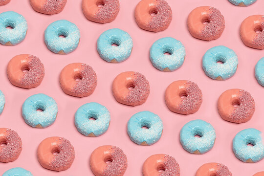 Homemade pink and blue glazed donuts