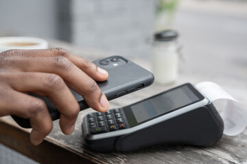 Crop View Of Man Using Cellphone For Paying