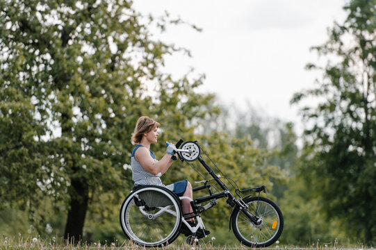 Content woman riding tricycle for people with special needs