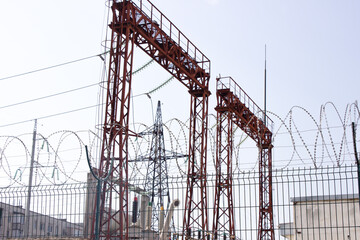 Electrical substation.Electric lines on blue sky background. Electrical industry