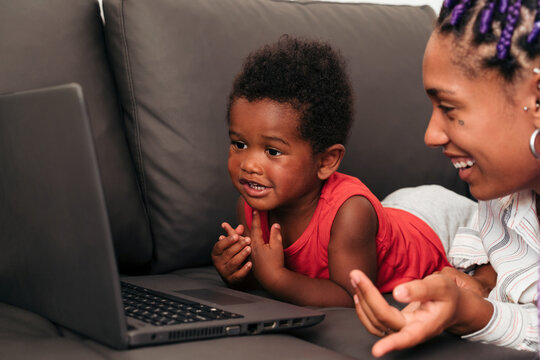 Young mother and son on laptop