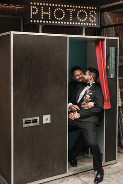 Gay couple in a photo booth