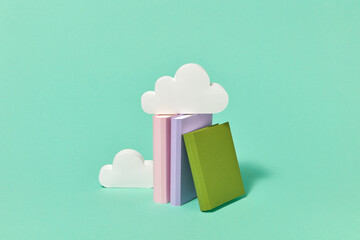 Handmade paper books library with craft clouds.