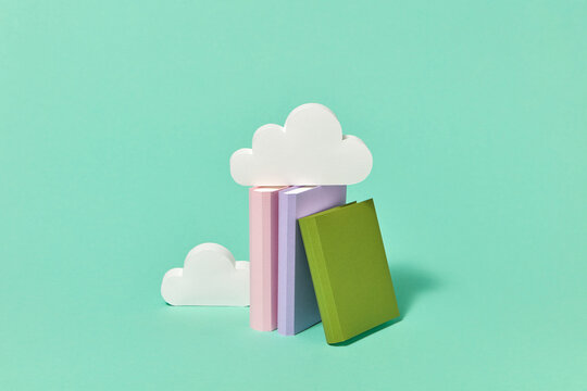 Handmade paper books library with craft clouds.