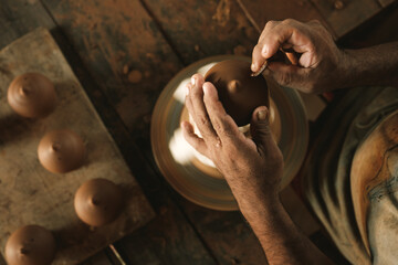 man working with clay