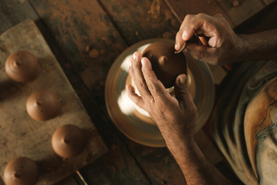 man working with clay