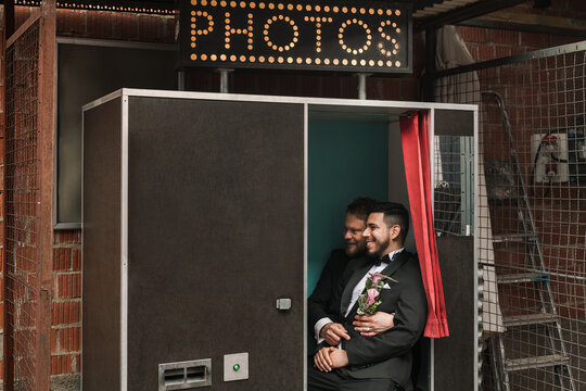 Gay couple in a photo booth