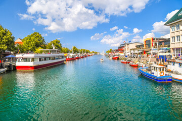 Boats line the Alter Strom Canal in the coastal city of Warnemunde, Rostock on the Baltic coast of...