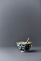 Traditional, handcrafted ceramic on gray background. Soft focus. Copy space.