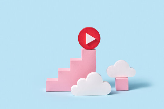 Papercraft red button play on a ladder with clouds.