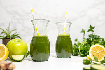 Green juice with yellow straws