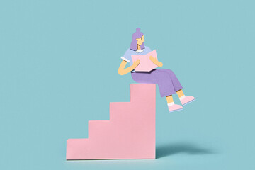 Papercraft schoolgirl is reading on a staircase.