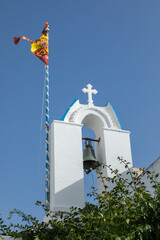 View of the bell tower of the church. Parikia, Paros Island, Greece.
