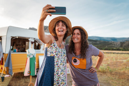 Entrepreneur women travelling in upcycling clothes caravan