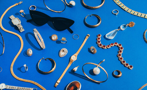 Jewellery,Diamonds, Ruby, Gold, Silver Etc/ On blue Background