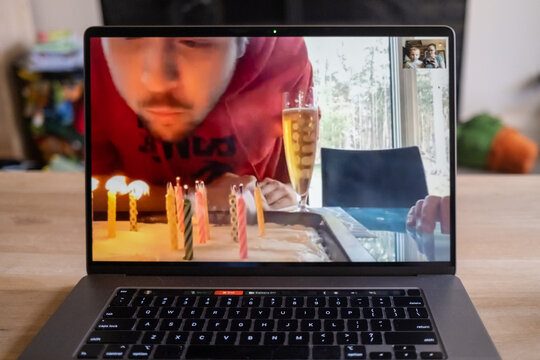Blowing out birthday candles over video call