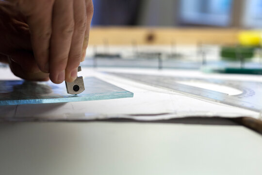 Artist making stained glass