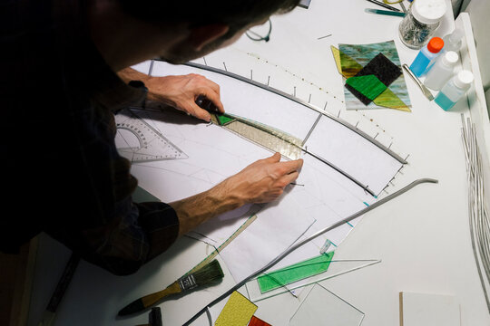 Artist making stained glass