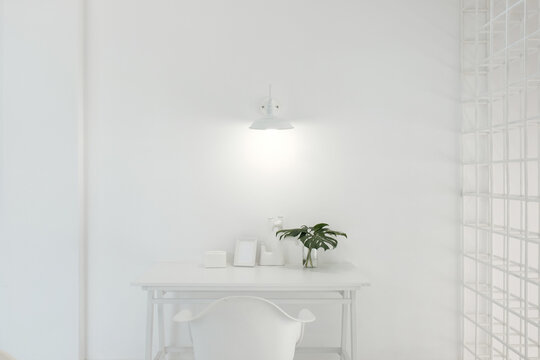 All White Table With Green Leaves