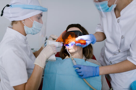 Dental office: Dentist treating patient