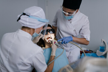 Dental office: Dentist treating patient